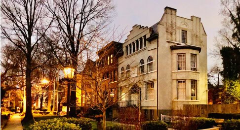 Gas-lit walking courts at night on the Louisville ghost tour route