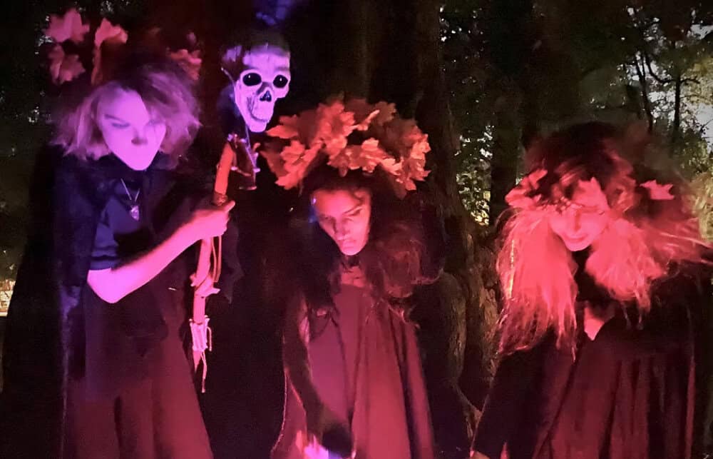 Costumed witches perform in Central Park during the Victorian Ghost Walk